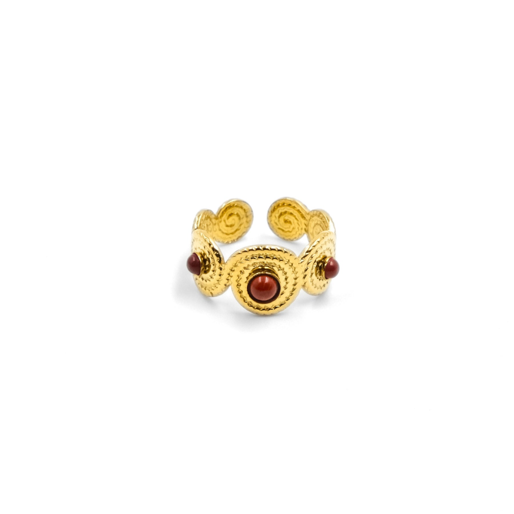 A Tibetan - style five - elements open ring with a golden - hued metal finish. It features intricate swirling patterns and is inlaid with red agate stones, intended to enhance confidence, love, and energy.