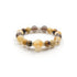 A Tibetan Goldwish Crystal Bracelet combining citrine and tiger eye beads. The citrine beads exhibit a warm, golden - yellow hue, while the tiger eye beads display earthy tones of brown and gold. Interspersed among the beads are elegant gold - toned, crystal - encrusted accents, adding a touch of luxury.
