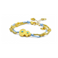Gold bracelet with blue beads on a white background