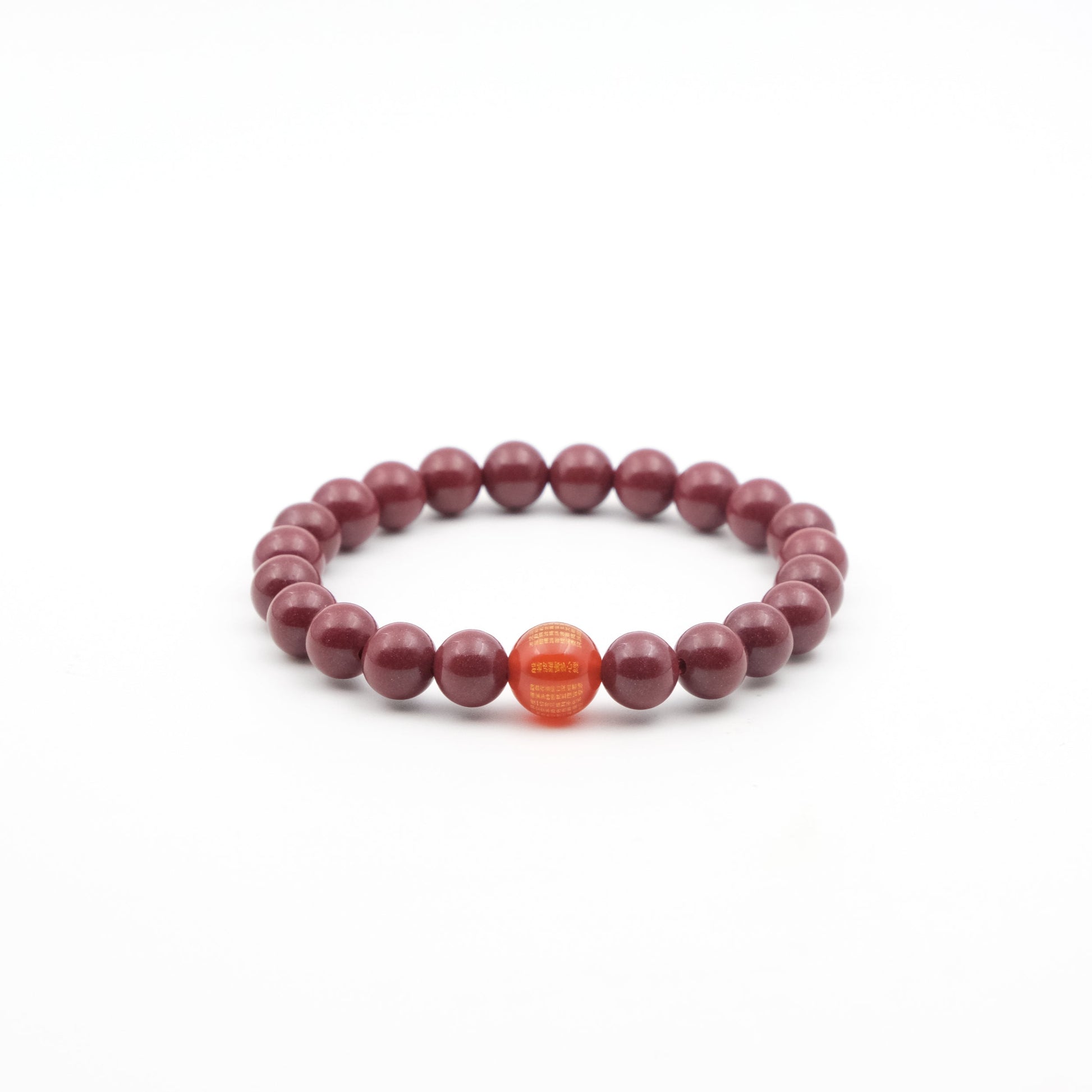 Tibetan Heart Sutra Cinnabar Beaded bracelet with a single orange bead on a white background