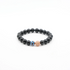 Black beaded Protection, Vitality & Inner Peace bracelet with a blue and pink accent bead on a white background
