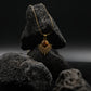 Gold necklace with a pendant on a  tiger`s eye stone against a dark background,  for Success & Abundance