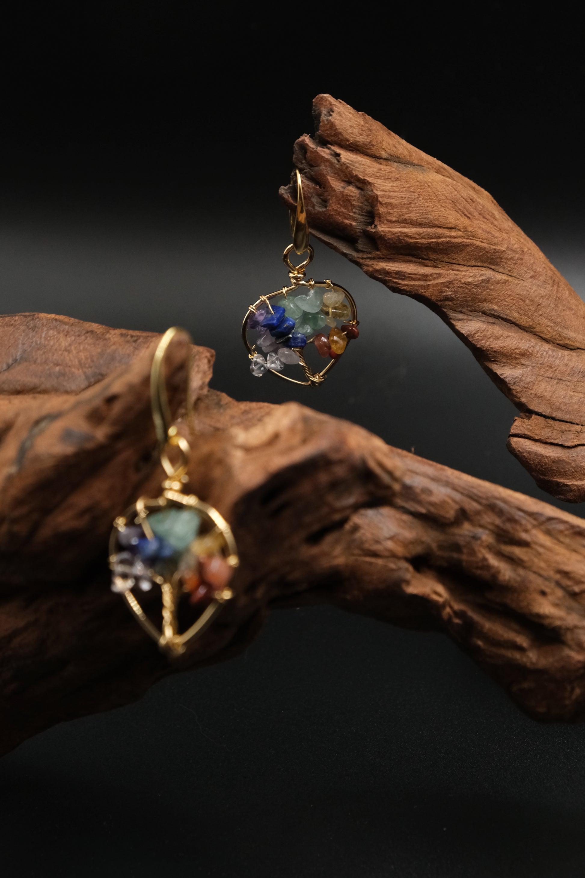 Tibetan Tree of Life Earrings, Multi-Crystal for Vitality & Protection, on a dark background