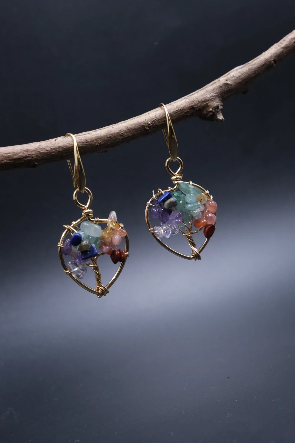 Tibetan Tree of Life Earrings, Multi-Crystal for Vitality & Protection, on a dark background