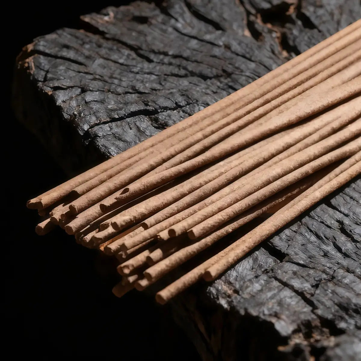 Himalayan Handcrafted Incense sticks on a dark, textured surface