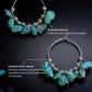 Turquoise stone and silver bead necklace on a dark background