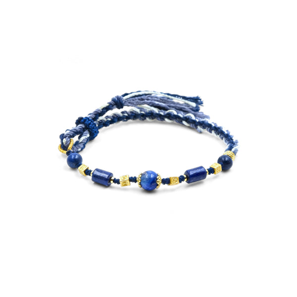 Wisdom & Protection Lapis Lazuli Woven Bracelet with deep blue natural lapis lazuli beads, gold accents, and hand-braided cord, spiritual jewelry for wisdom, protection, and balance on a minimalist white background.
